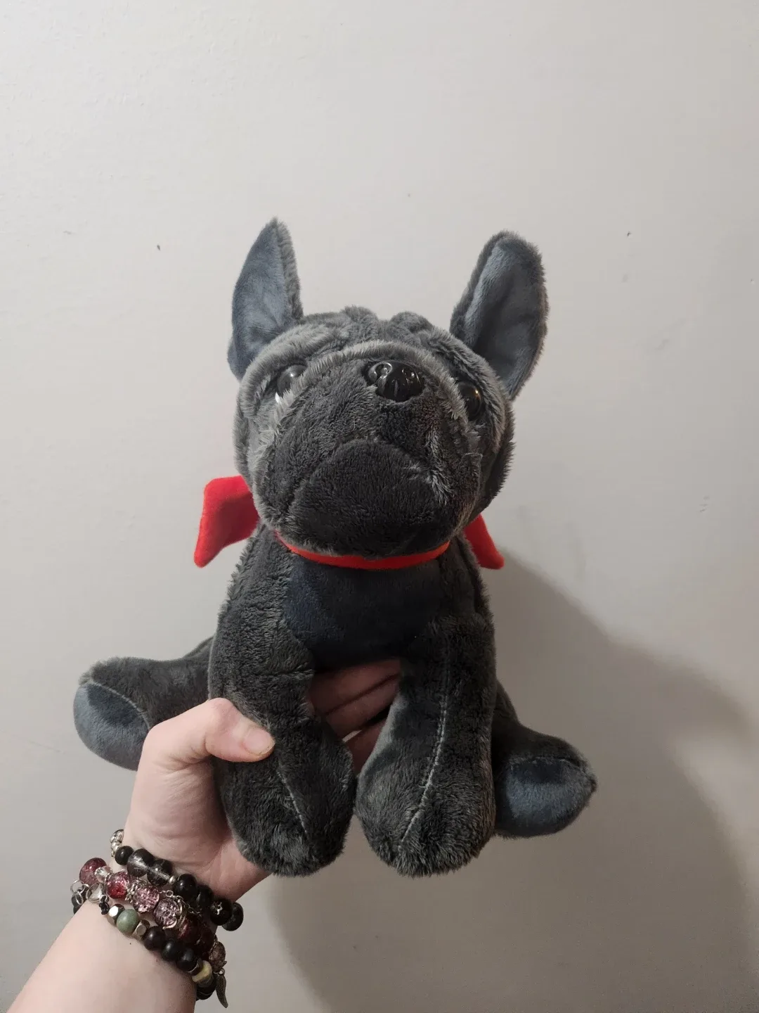 plush grey dog with red bow heating stuffie