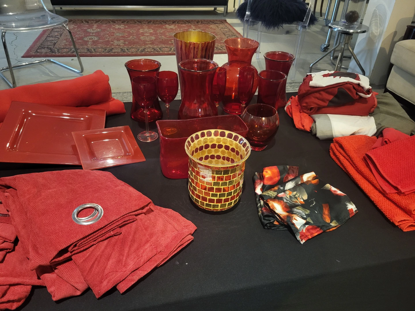 Assorted red home decor and table setting items