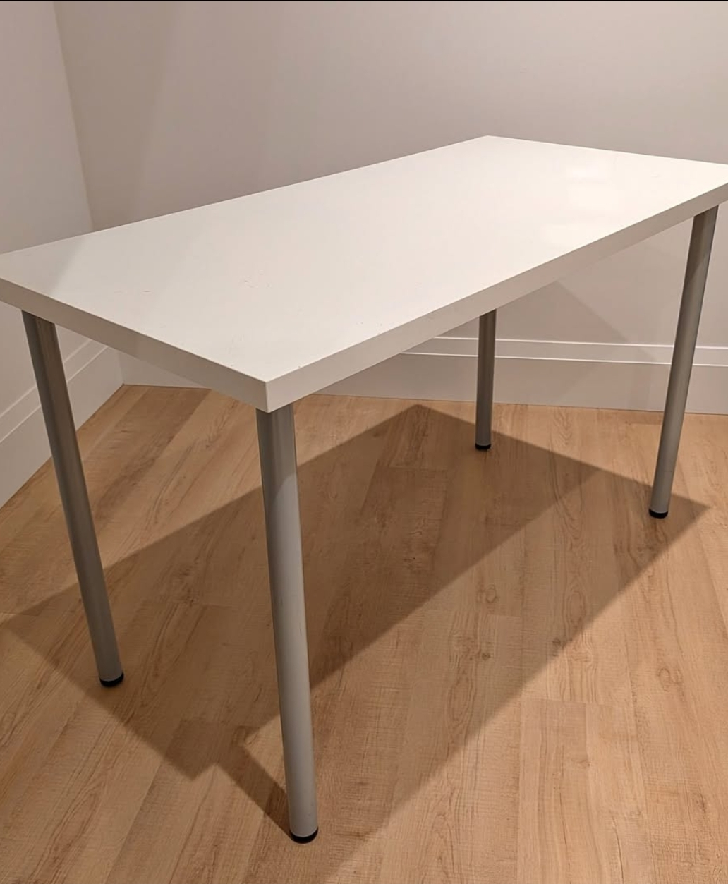 White IKEA table with grey legs