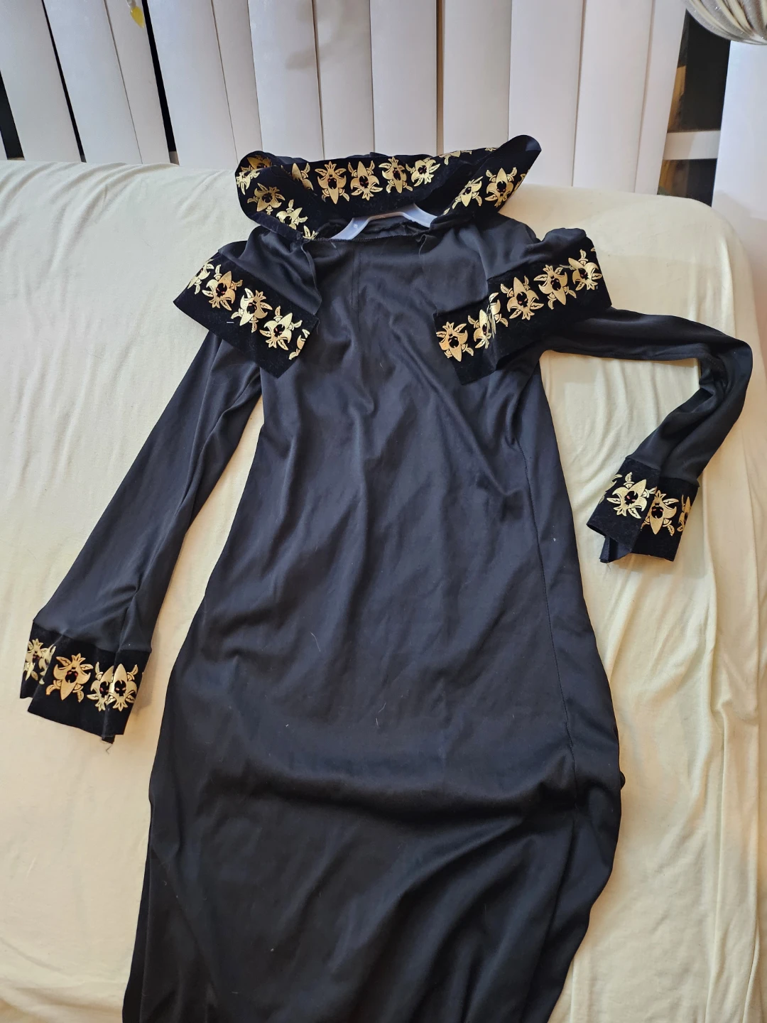 Black hooded dress with gold detailing