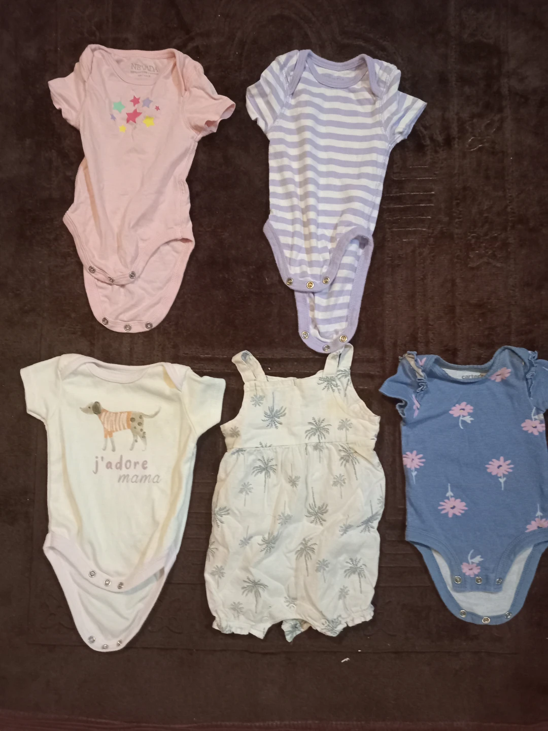 Several baby newborn-3 month clothes.