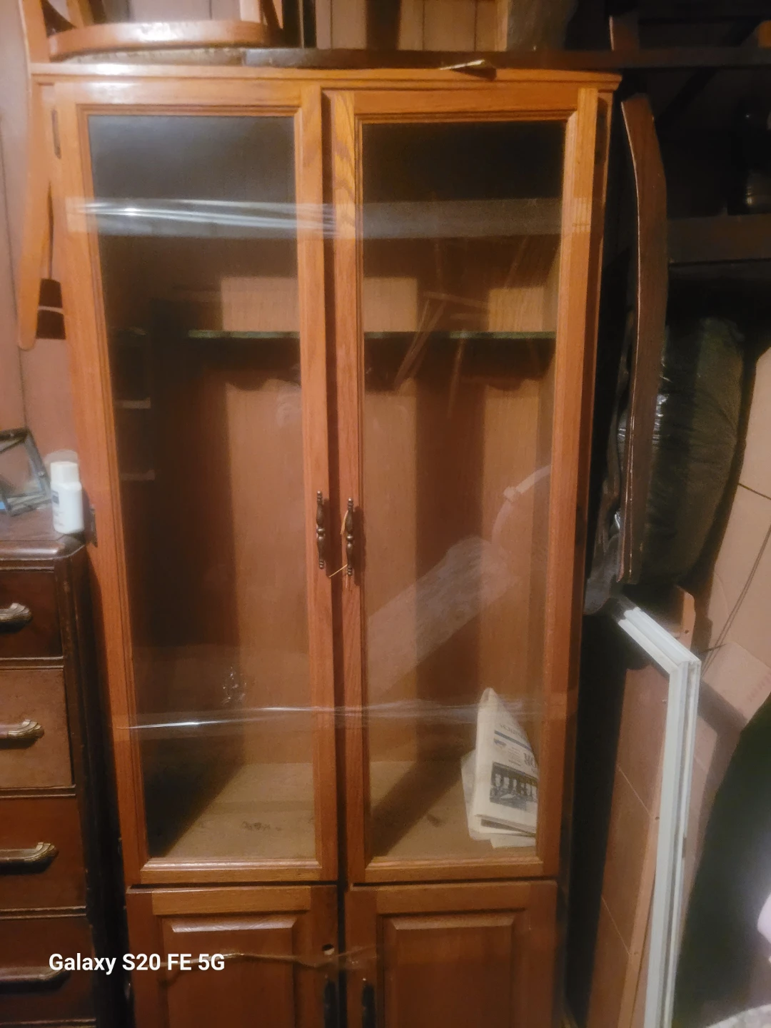 Wooden display cabinet with glass doors