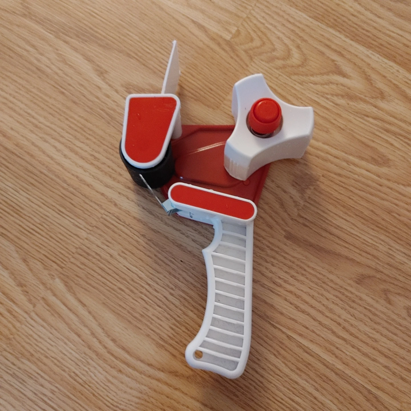 Manual tape dispenser gun