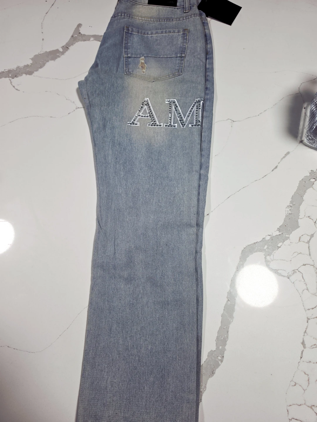 AMIRI Light Wash Distressed Jeans - photo 2