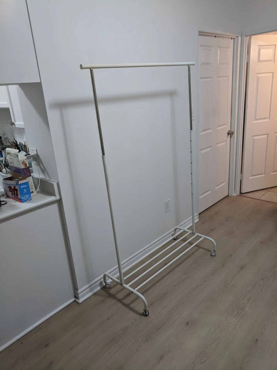 White metal clothing rack with wheels - photo 3