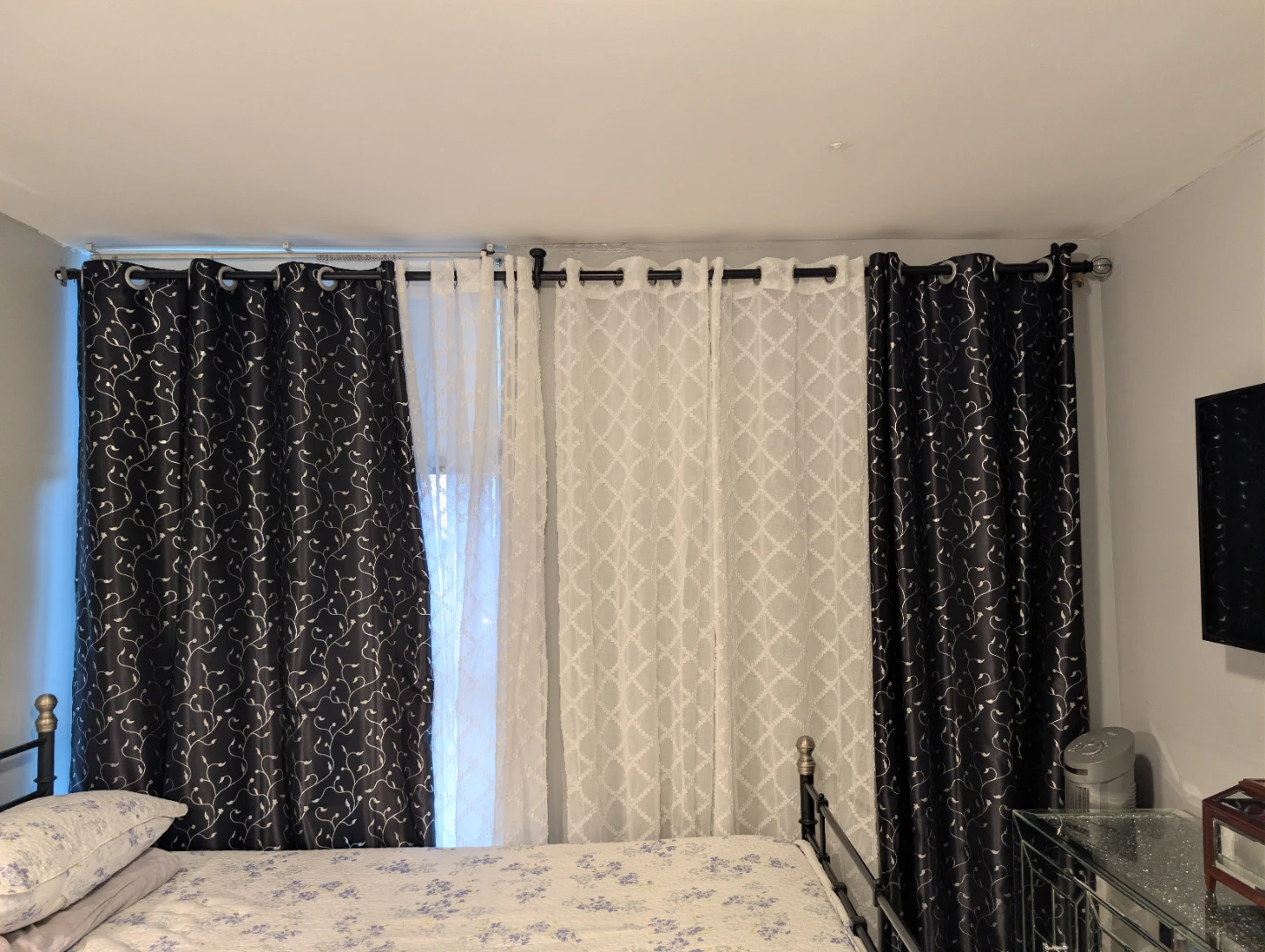 Set of black floral and white patterned curtains
