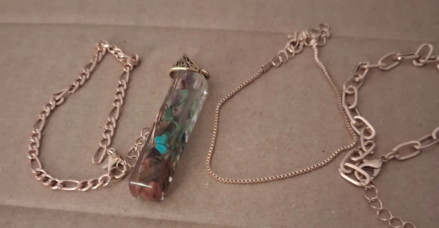 Rose gold tone bracelets and crystal pendant
