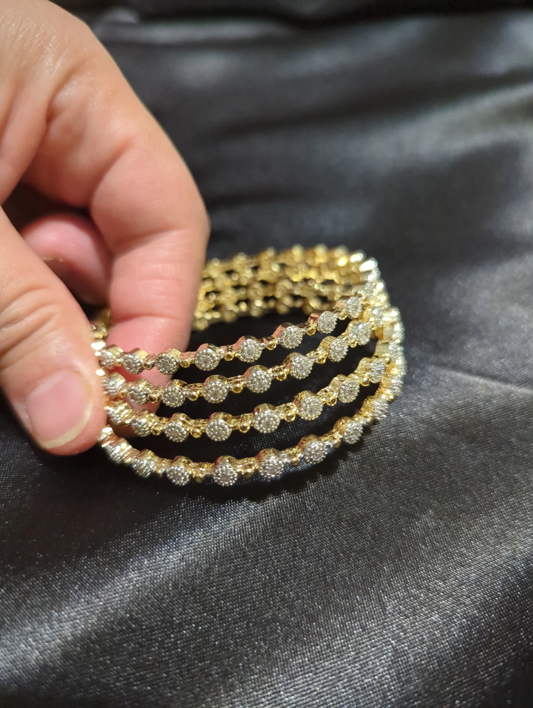 Set of four gold-tone bangles - photo 3