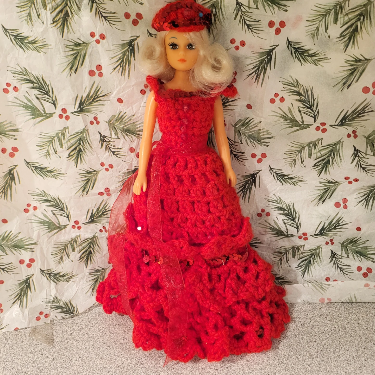 Vintage doll in handmade red crochet gown
