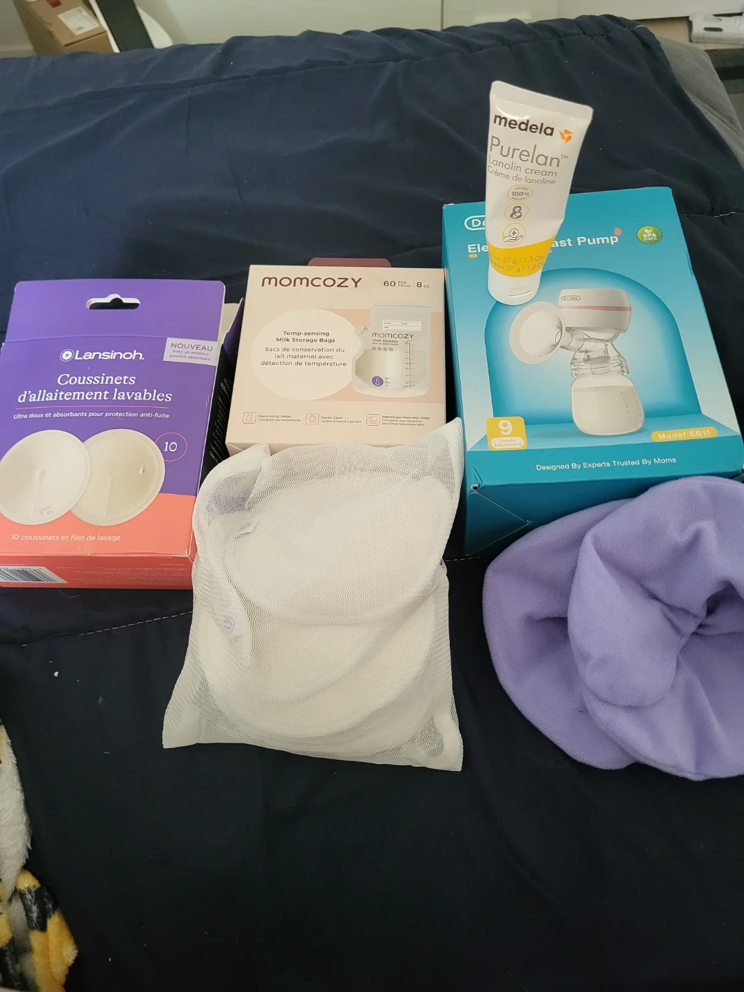 Breastfeeding bundle: Pump, storage bags, pads, and cream