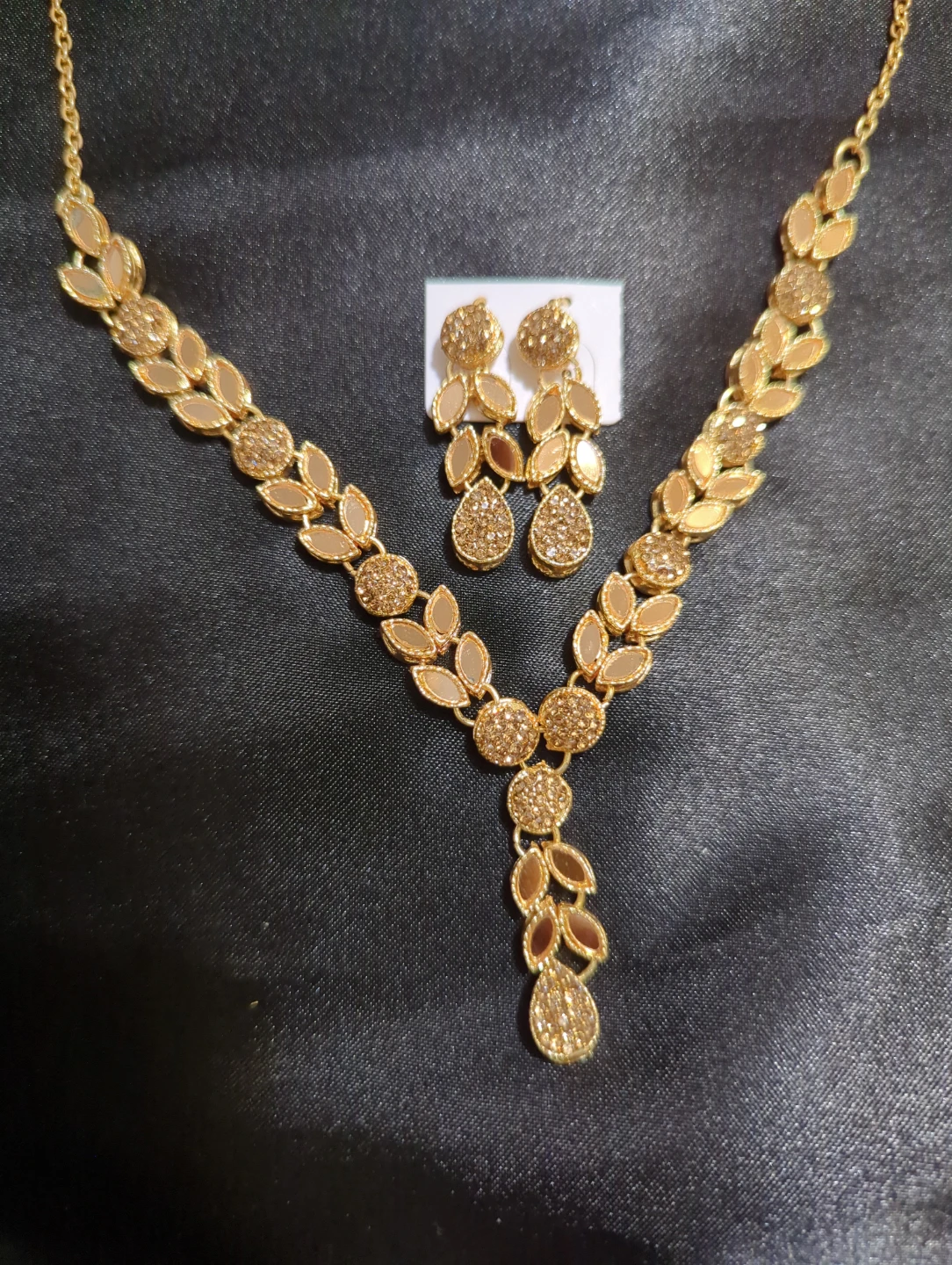 Gold-tone leaf design necklace and earring set
