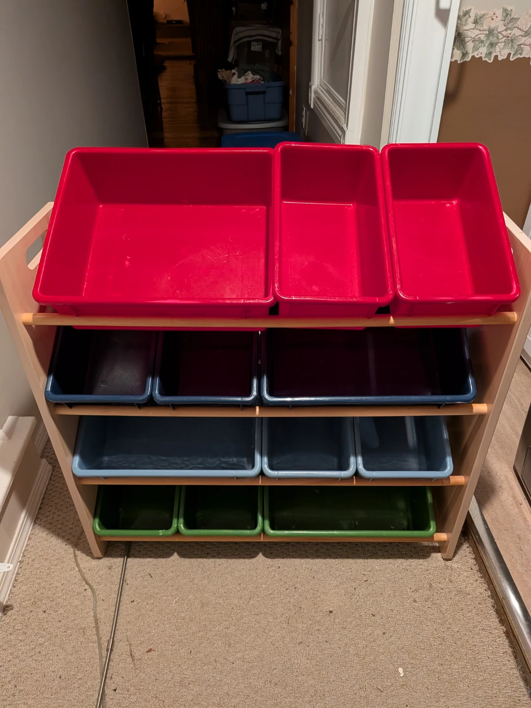 Toy storage shelf with bins