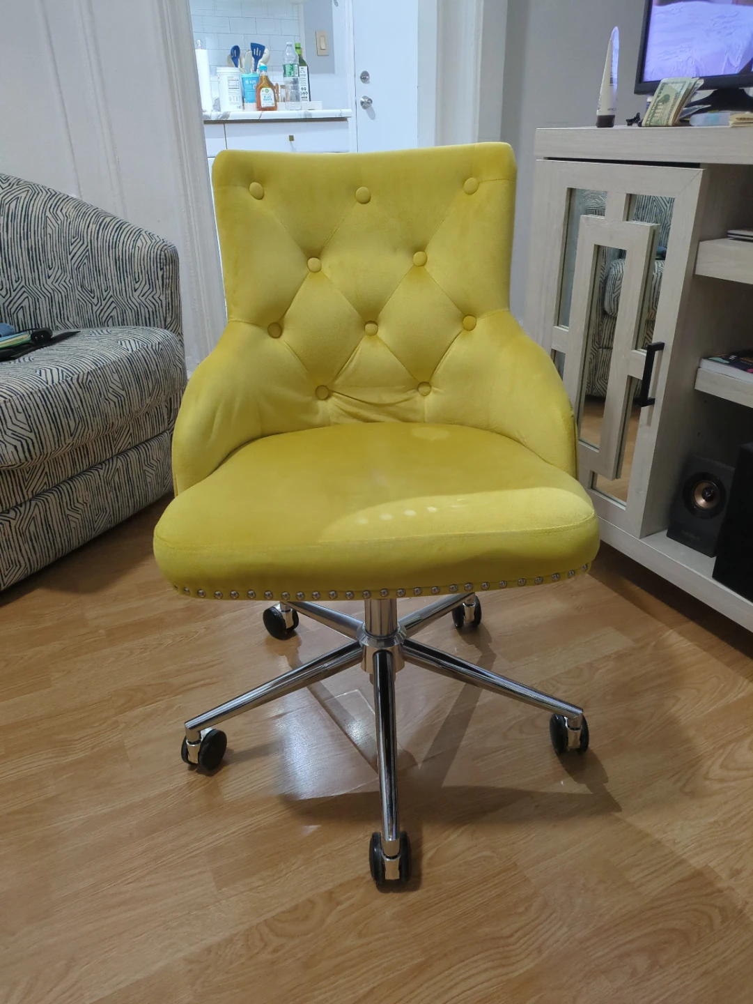 Yellow velvet swivel chair
