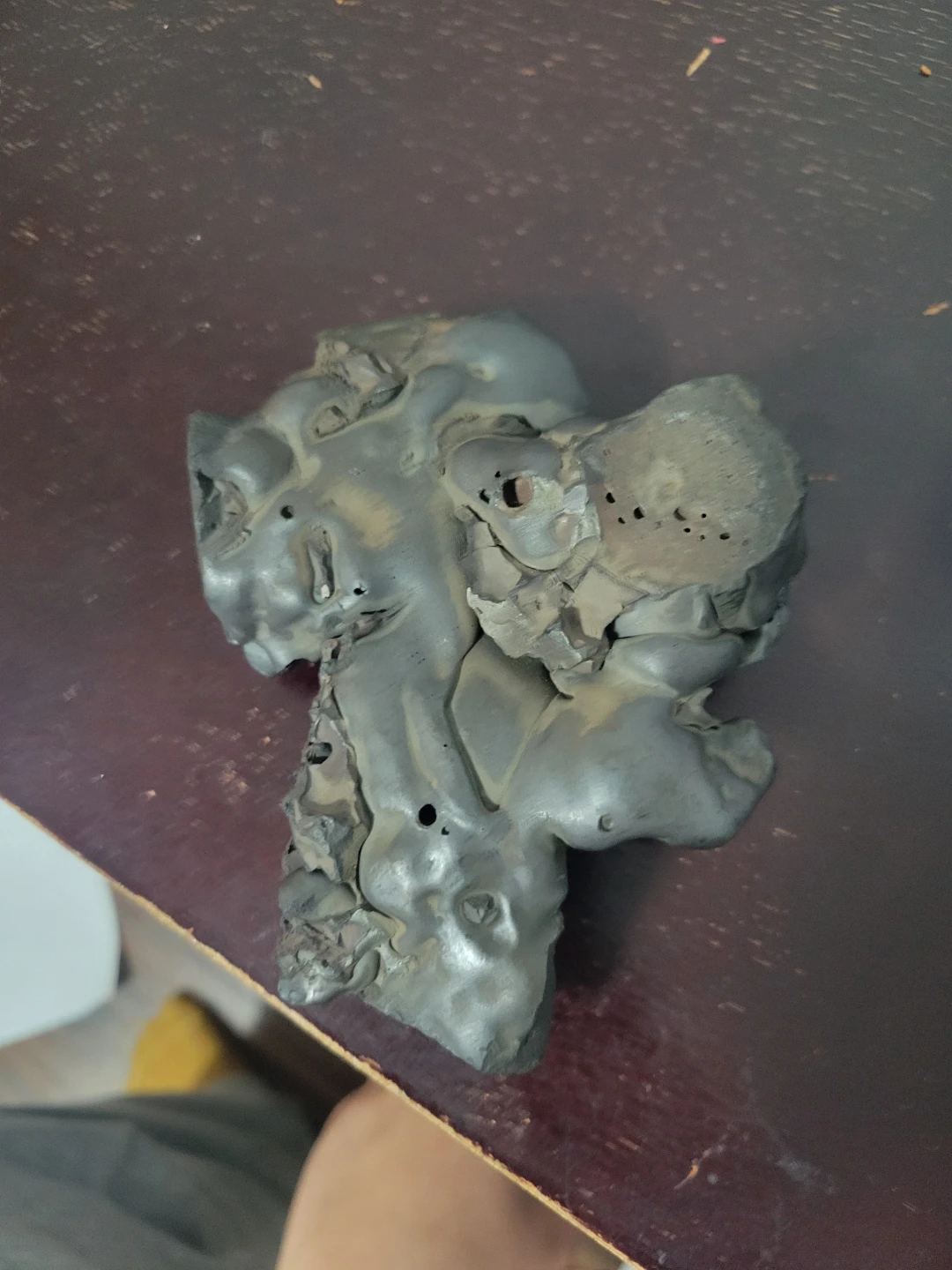 A metallic stone that looks like a dog. - photo 3