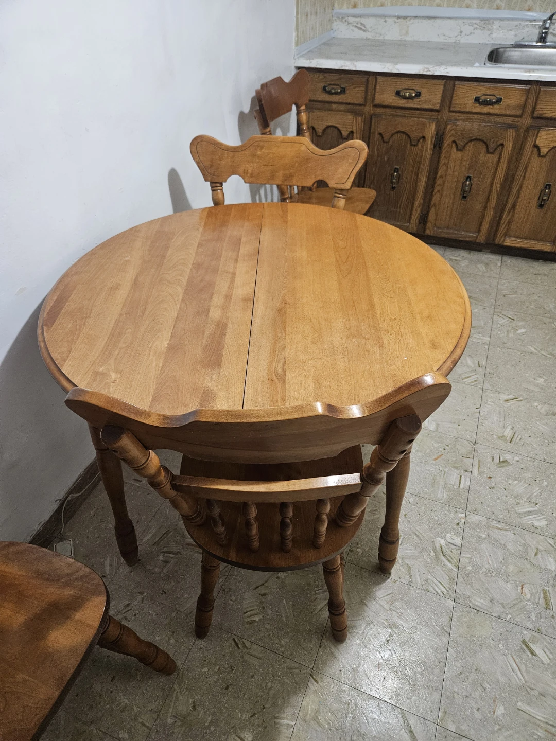 Wooden dining table with four chairs