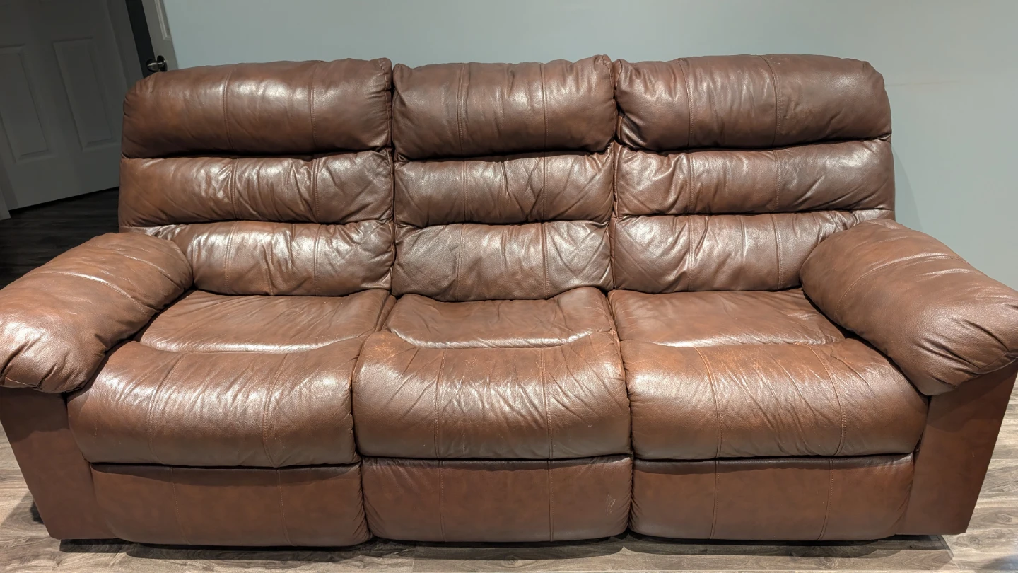 Ashley's 3 Piece Reclining Leather Sofa Set + Coffee Table