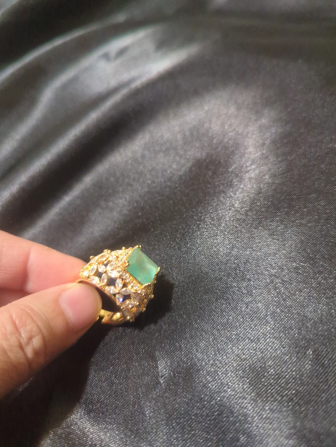 Gold-tone fashion ring with green stone