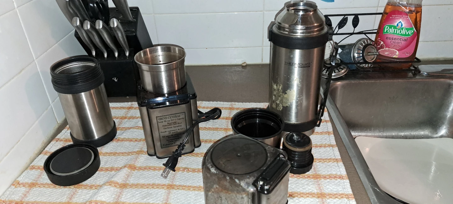 Two thermos and coffee grinder