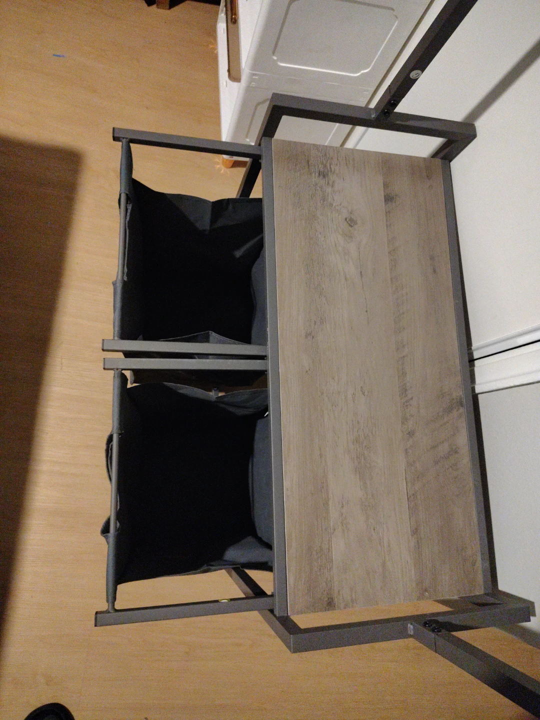 Clothing rack with dual laundry hampers - photo 4