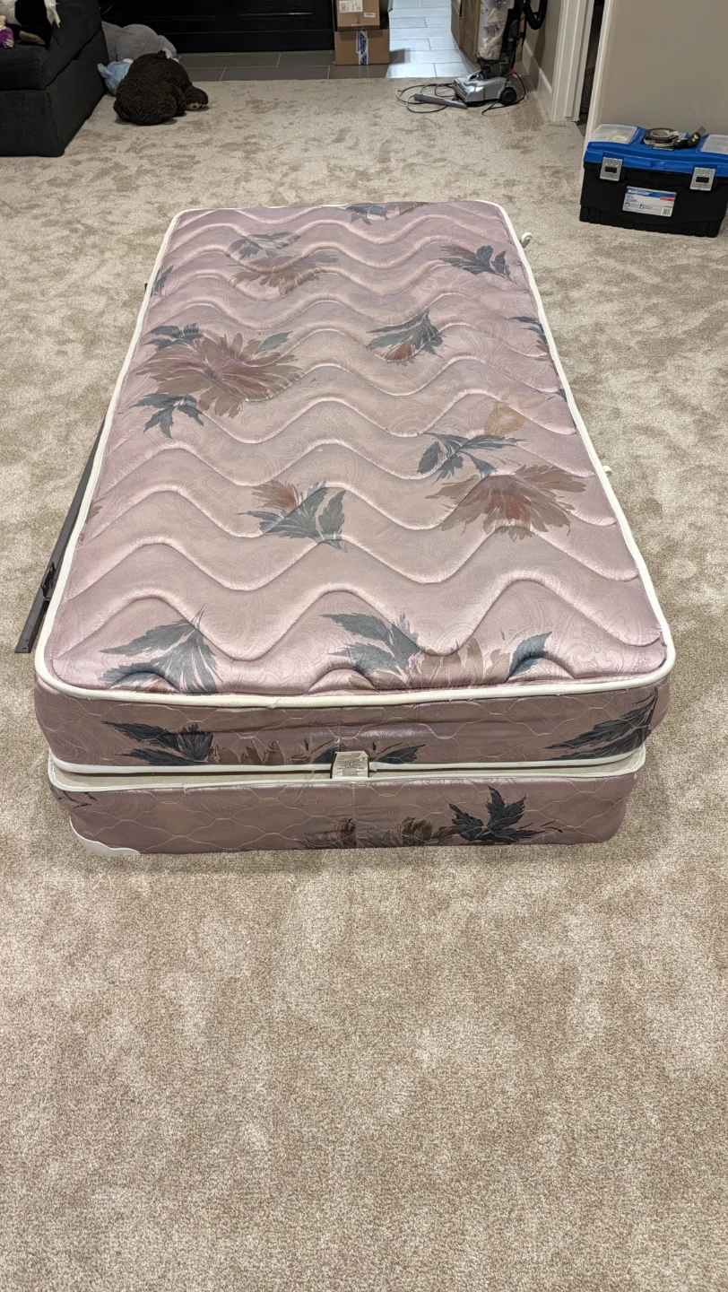 Single bed with mattress and metal frame
