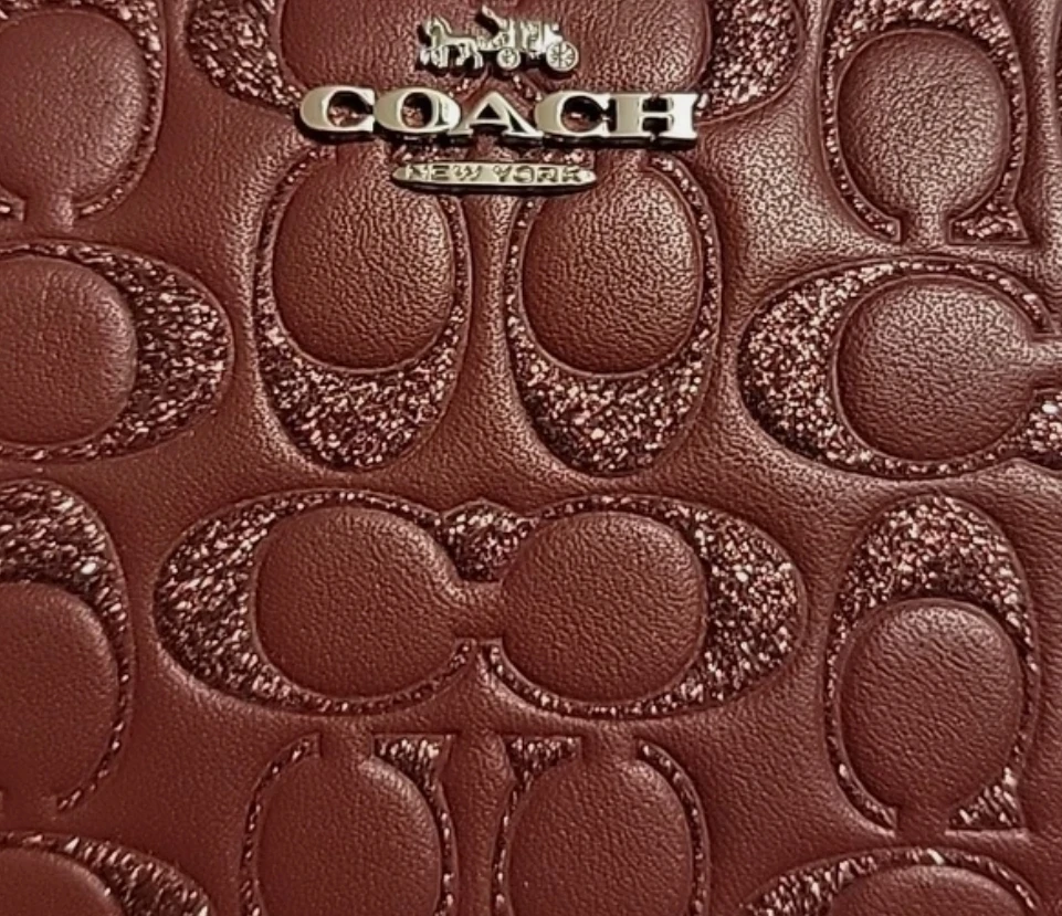 Coach Signature Debossed Wristlet