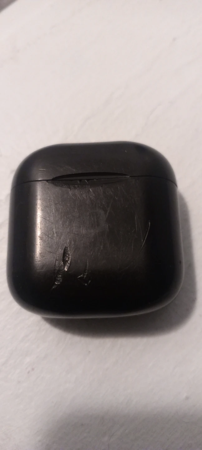 Black wireless earbuds with charging case