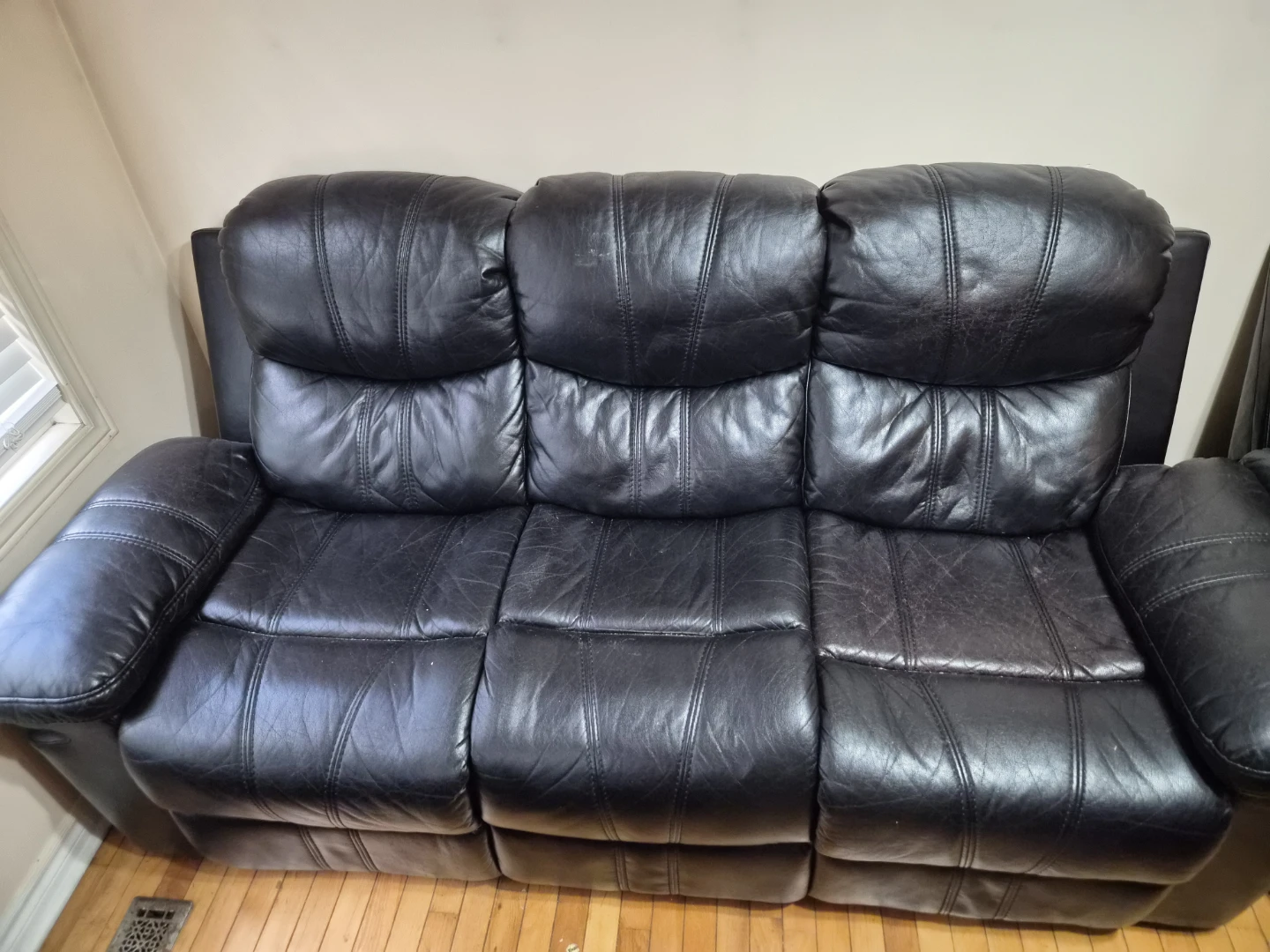 Black leather reclining sofa
