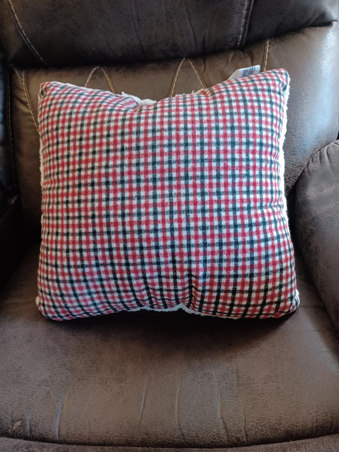 Red and black plaid throw cushion