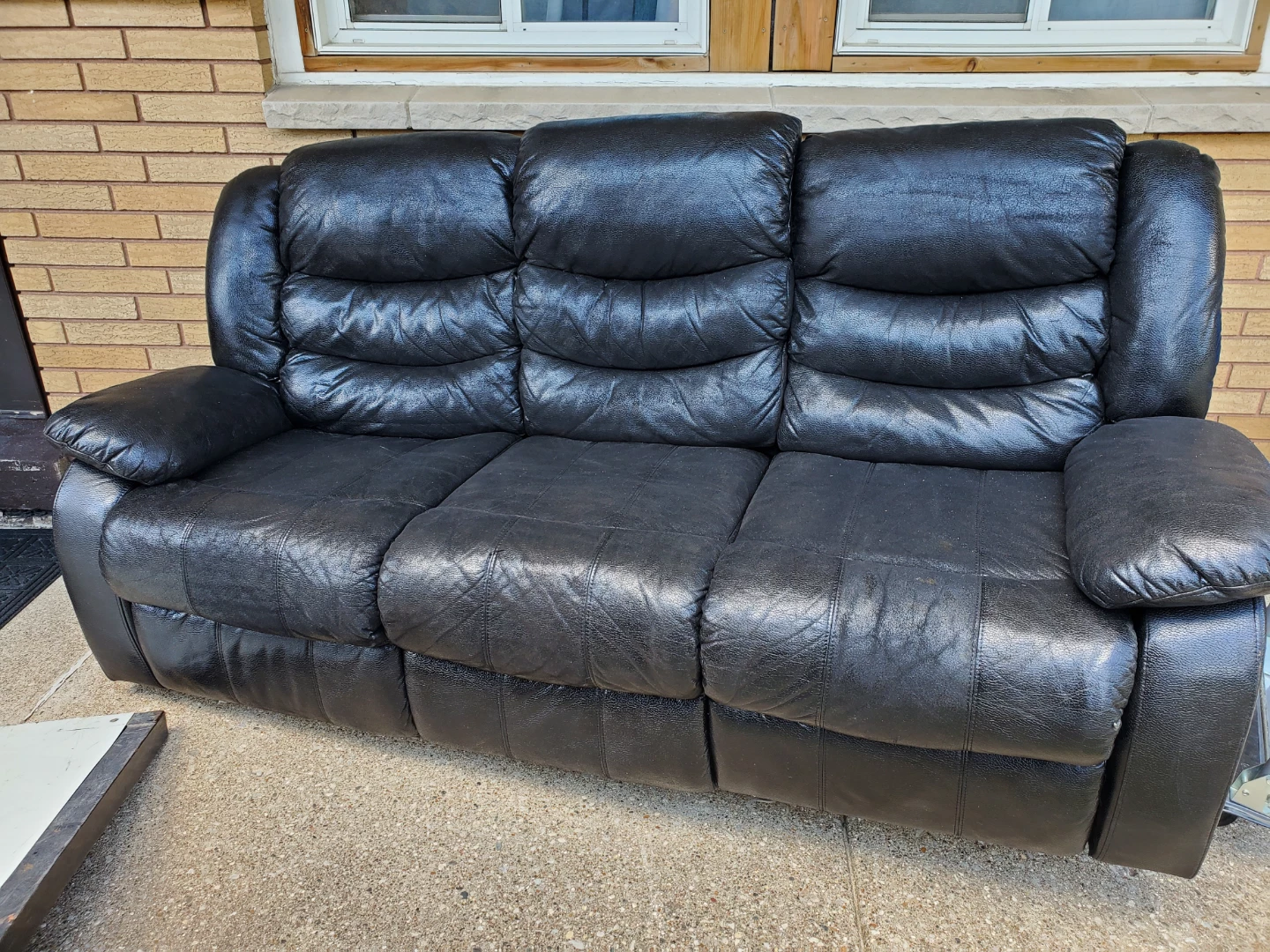 Black Genuine leather couch with electric recliners