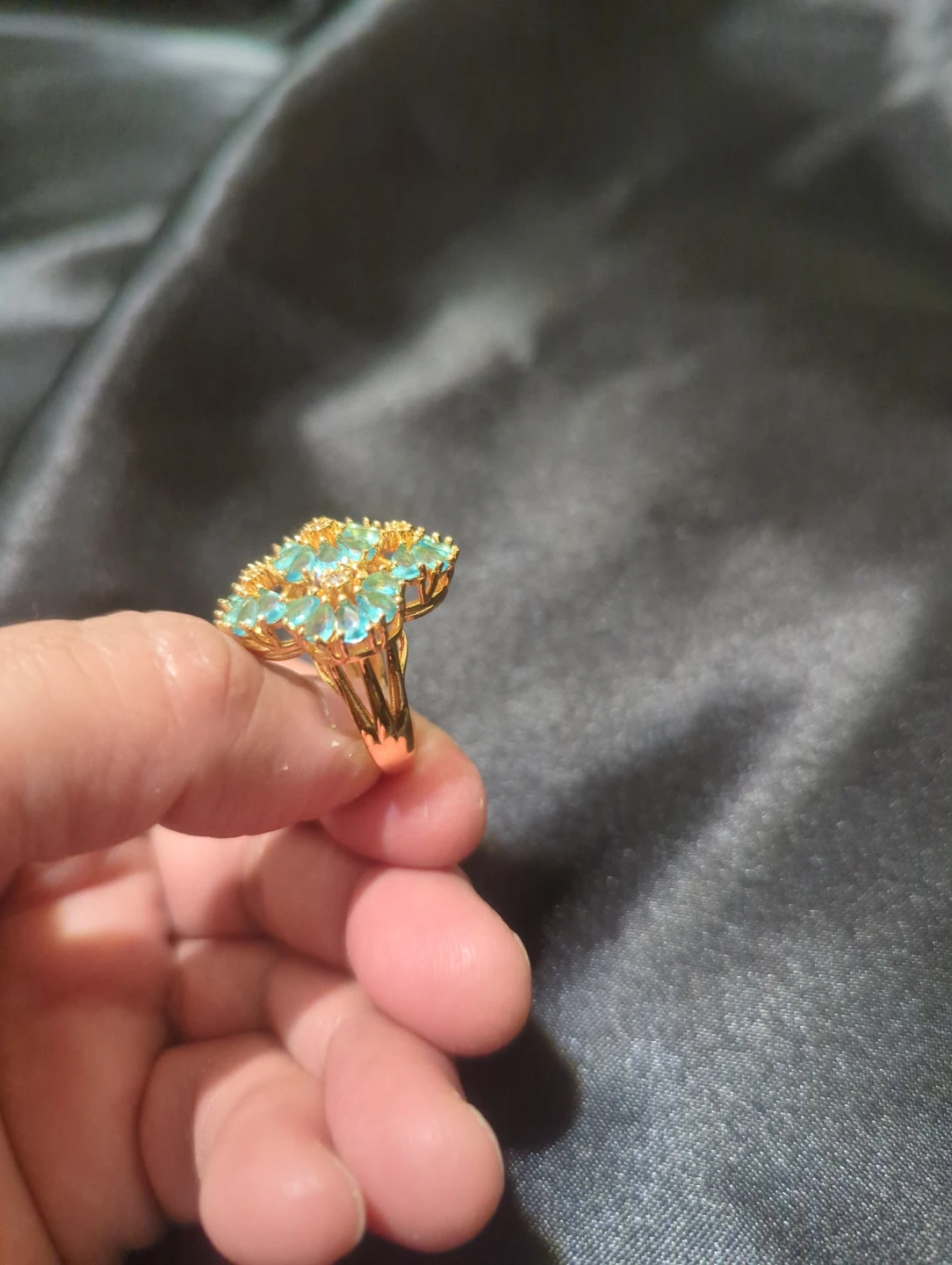 Gold-tone floral cocktail ring with blue stones