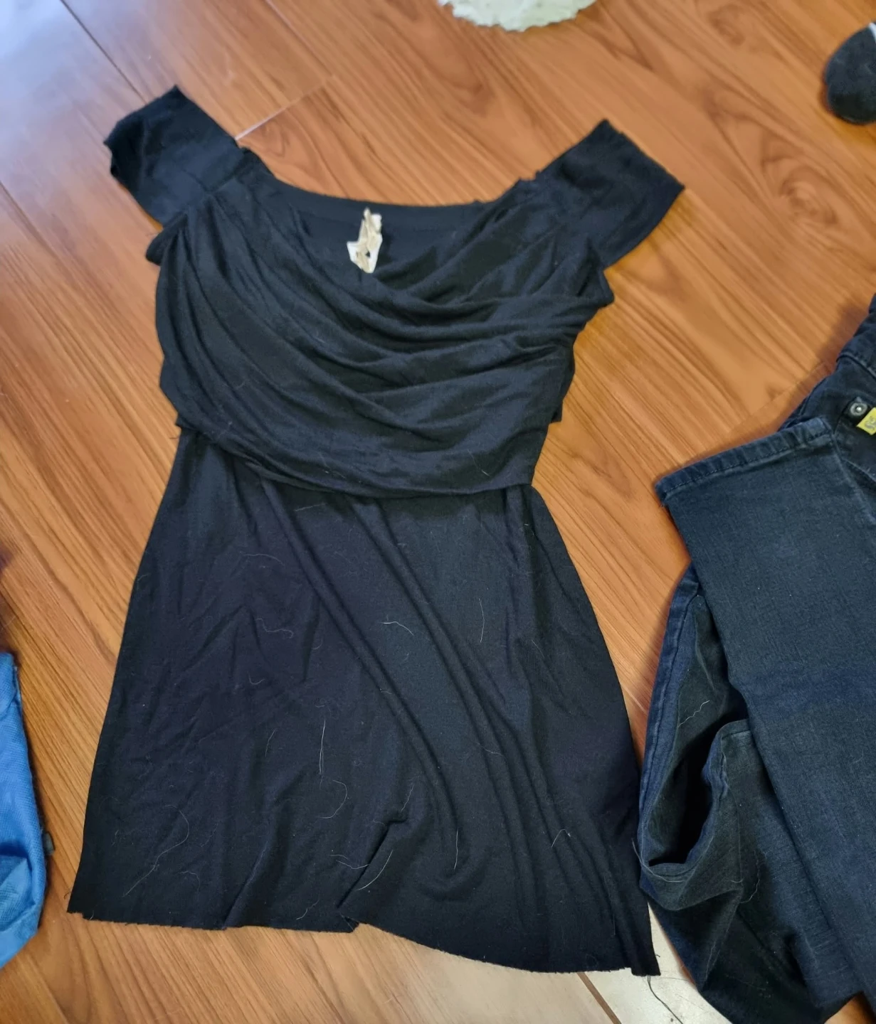 Black off-the-shoulder draped top