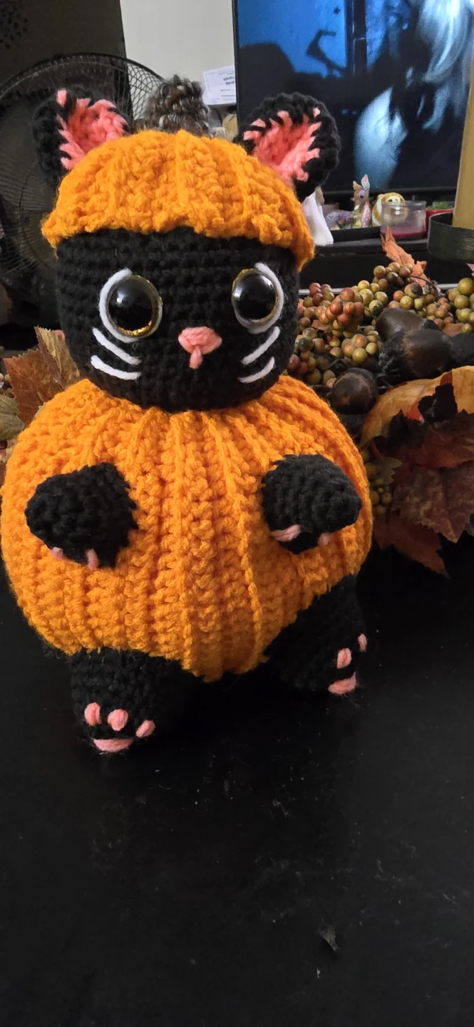 Hand-crocheted pumpkin cat plush