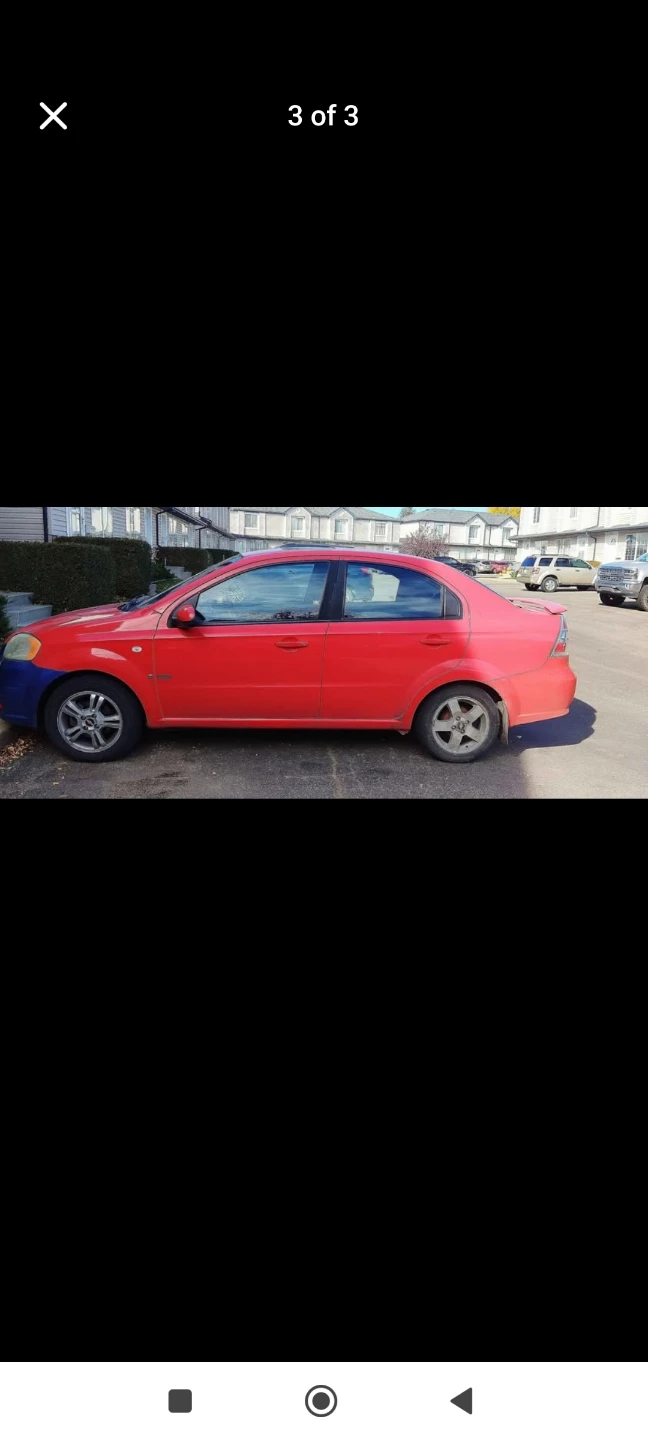 Red Chevrolet Aveo Sedan