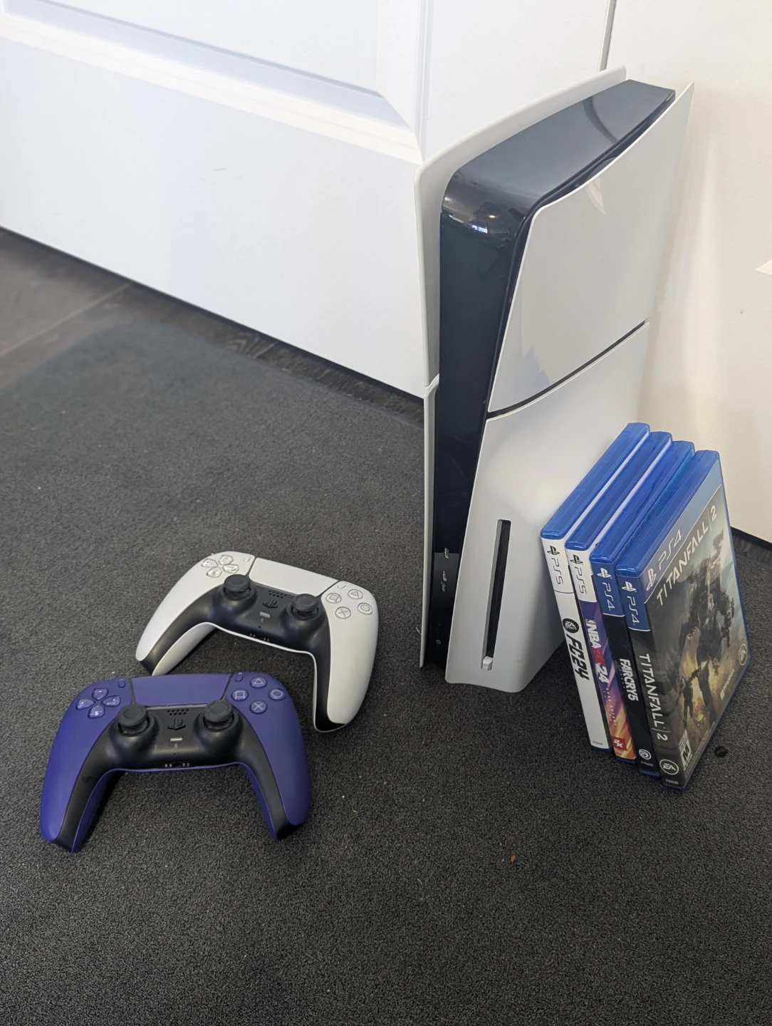 PlayStation 5 slim 1TB with 2 controllers and games