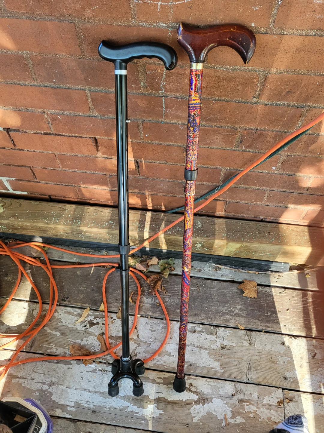 Two adjustable walking canes open to offers