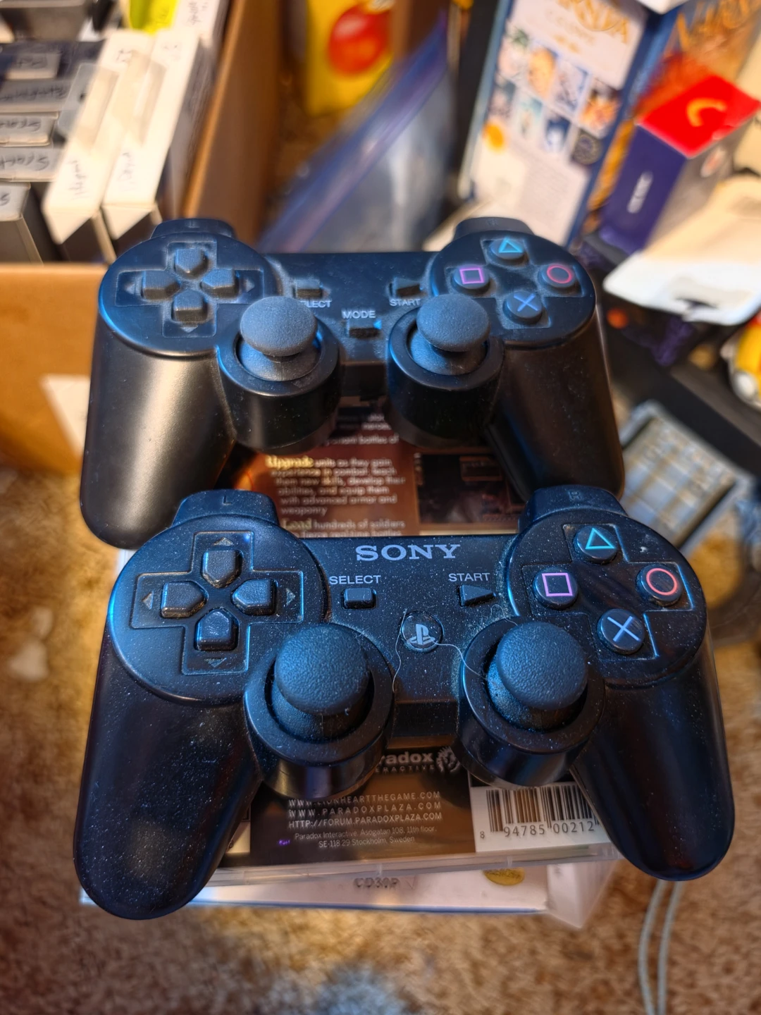 Two Sony PlayStation 3 DualShock 3 Controllers