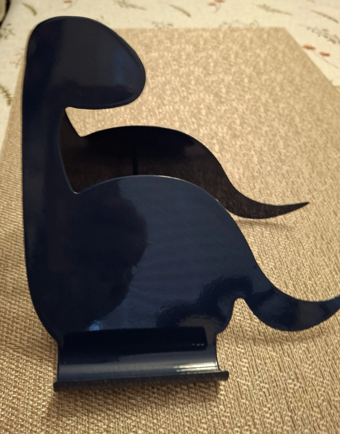 Dinosaur shaped metal book holder