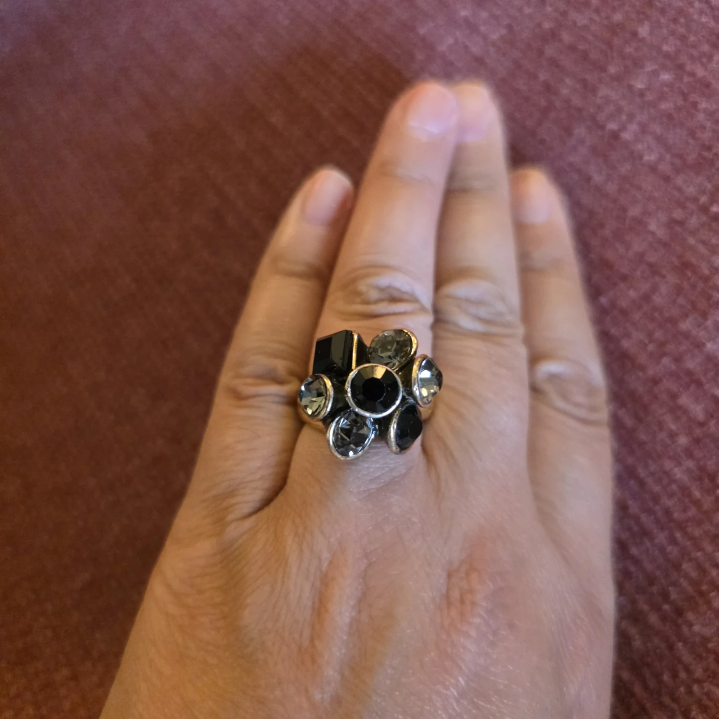 Gold-toned statement ring with black and grey stones