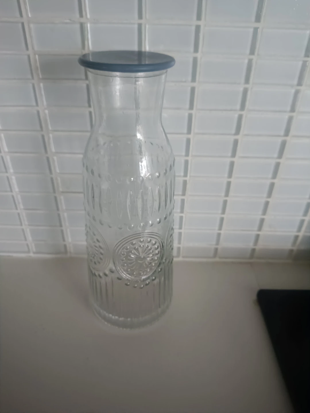 Clear glass water carafe with lid