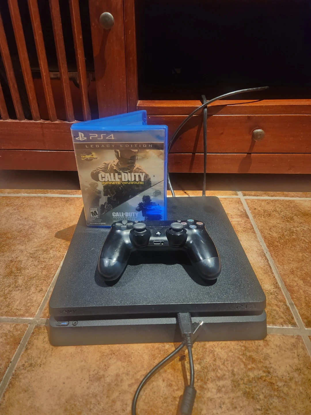 Sony PlayStation 4 Slim Console with Controller and Game