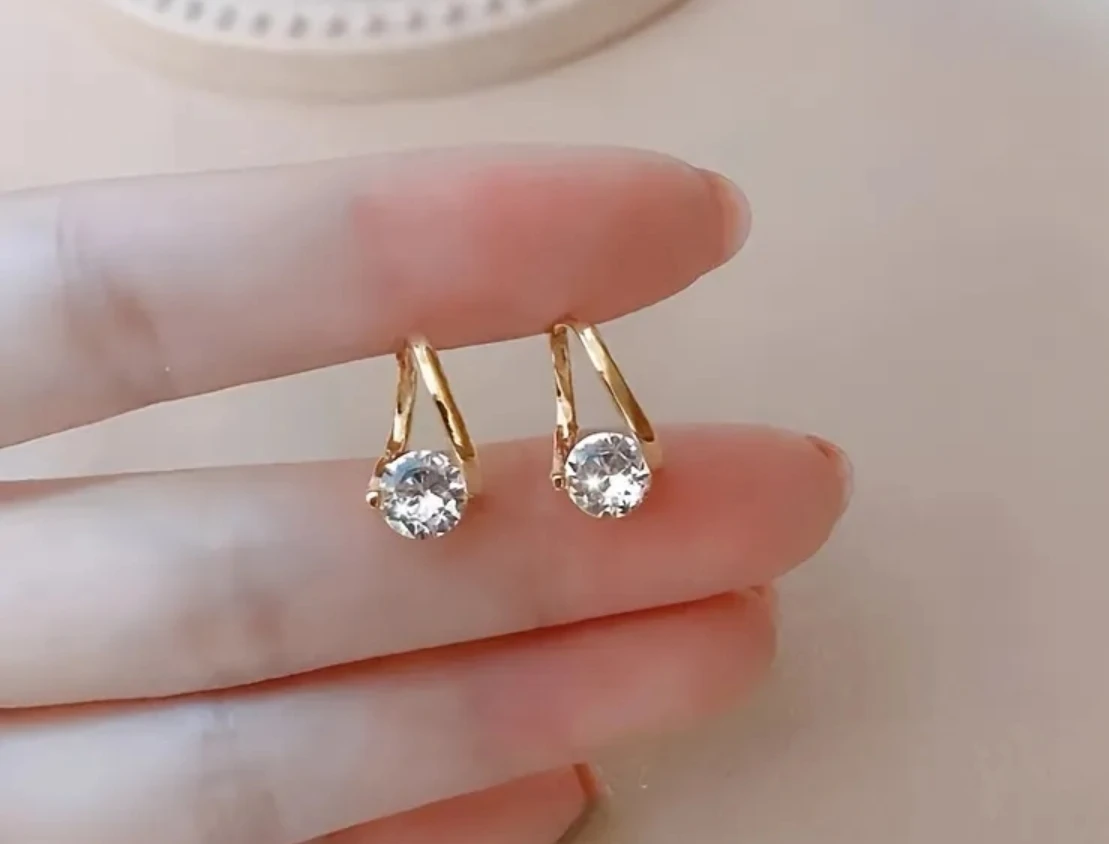Gold-toned hoop earrings with crystal stones