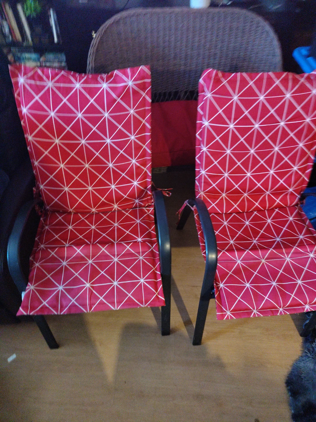 One Wicker loveseat and two patio chairs with cushions