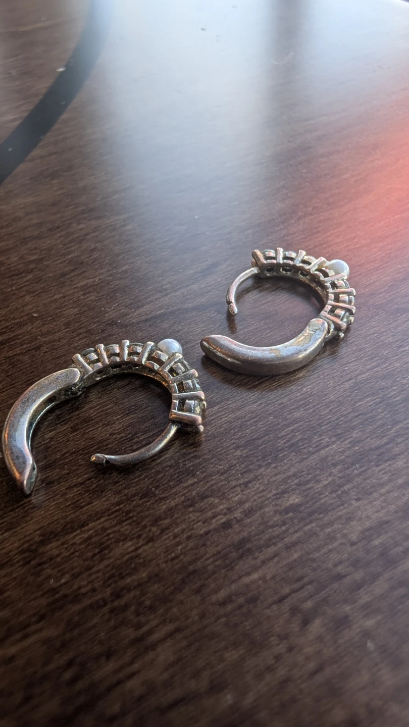 Silver-toned hoop earrings with pearl accents