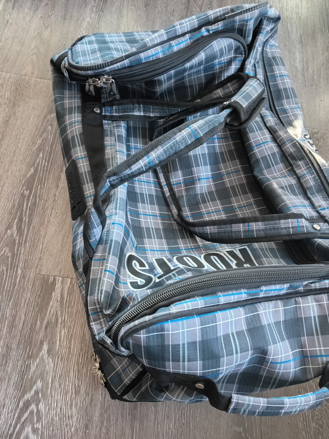 Roots Plaid Rolling Duffel Bag