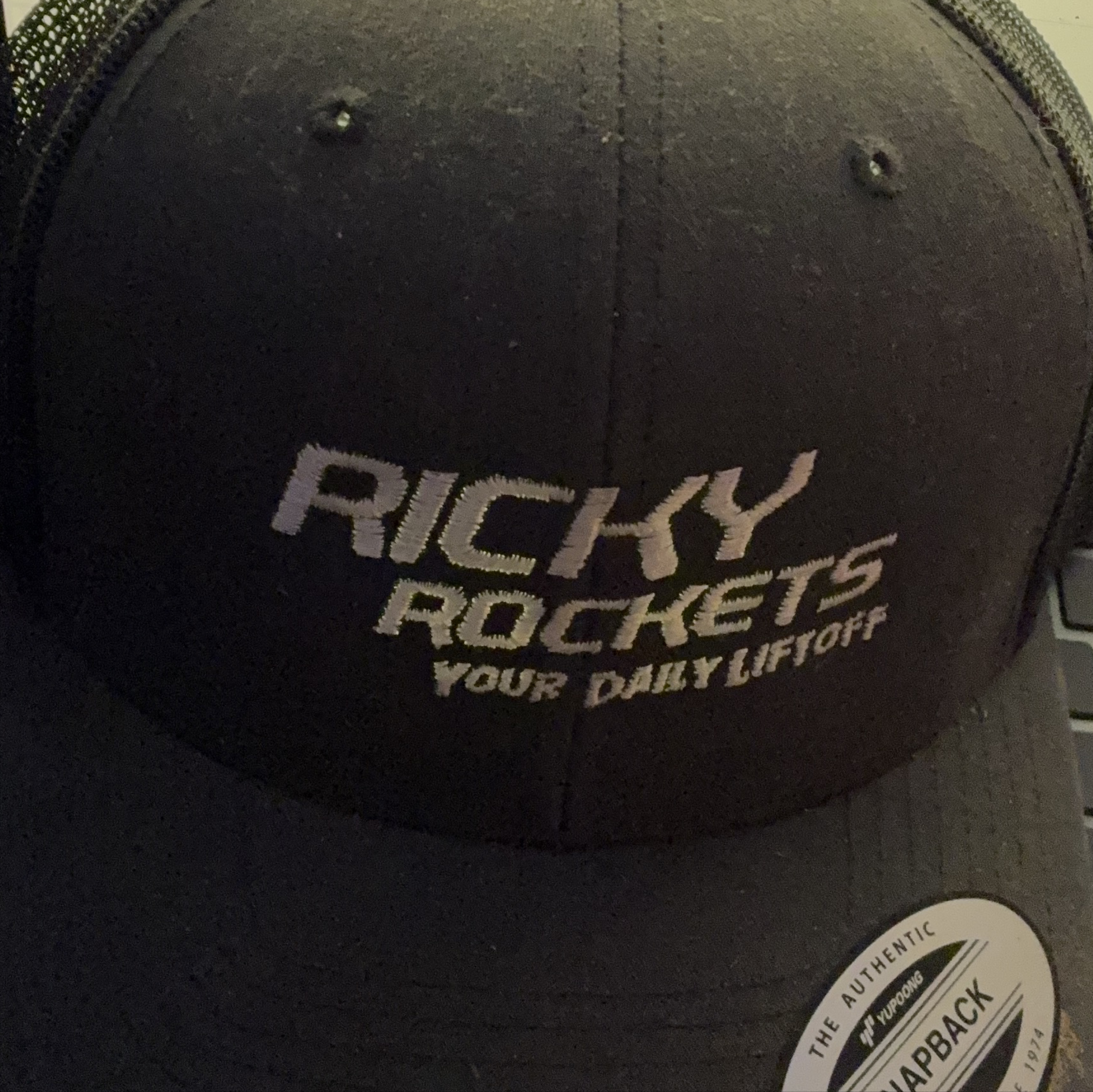 Ricky Rockets Your Daily Liftoff Black Trucker Hat 🥕 thumbnail