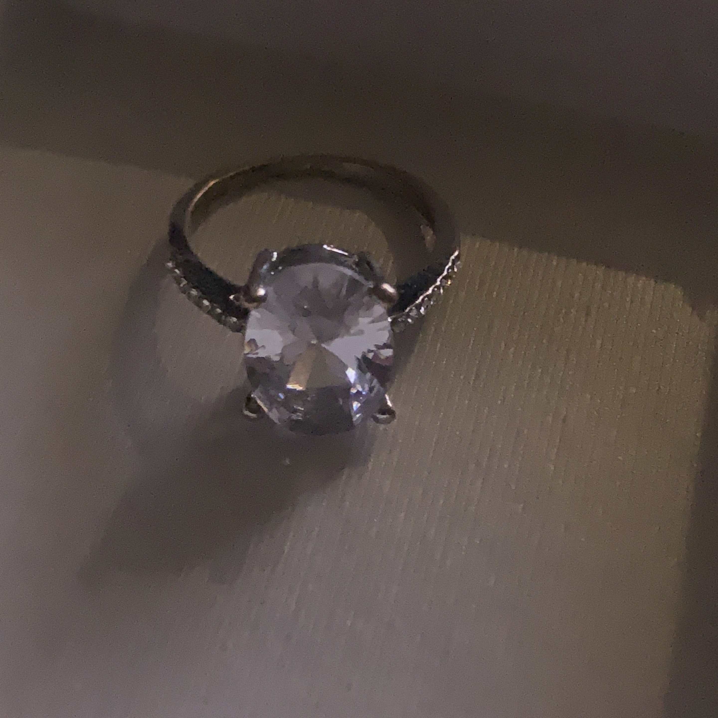 Oval-cut Solitaire Ring with Accents