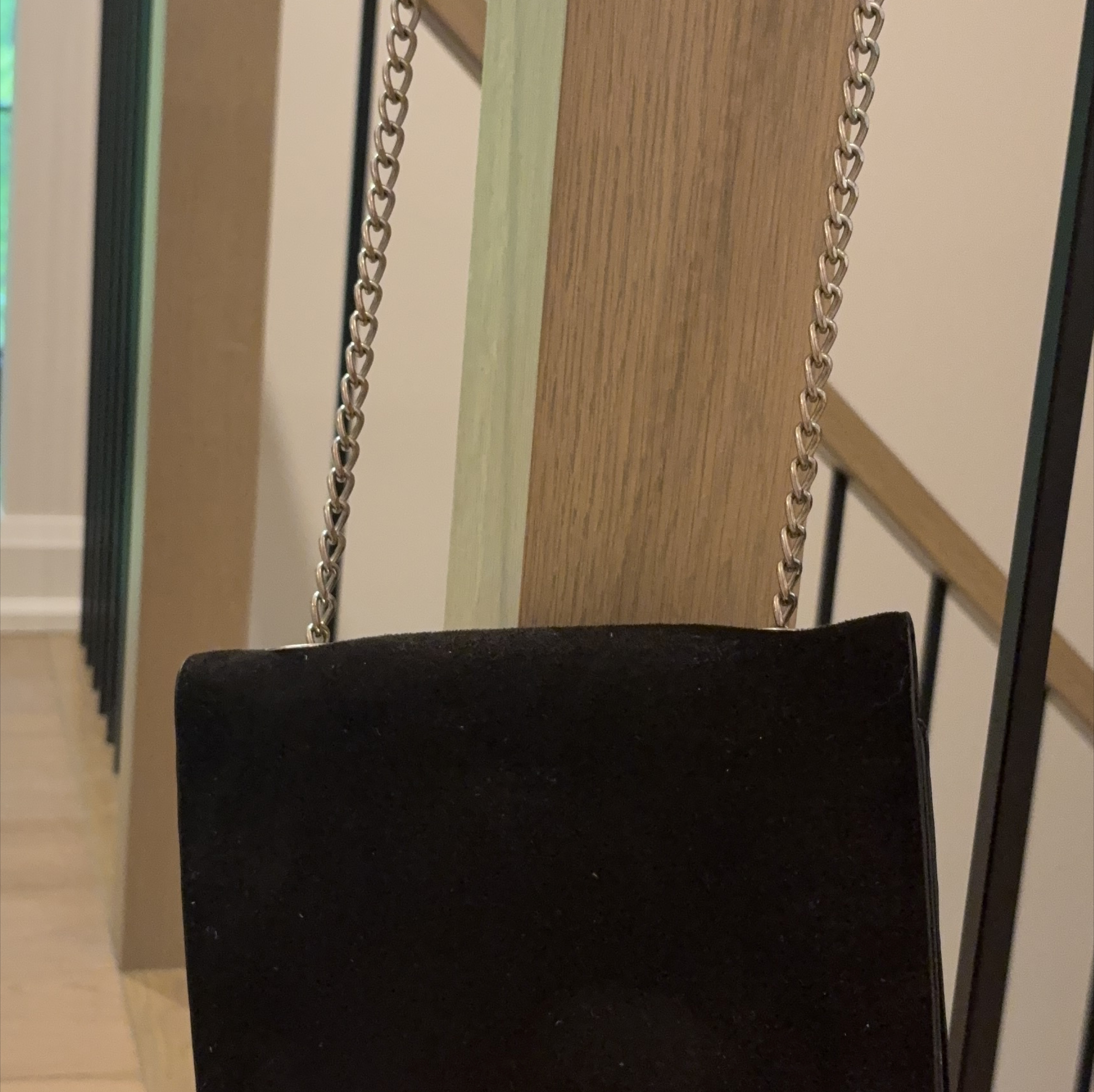 Black clutch with silver chain strap