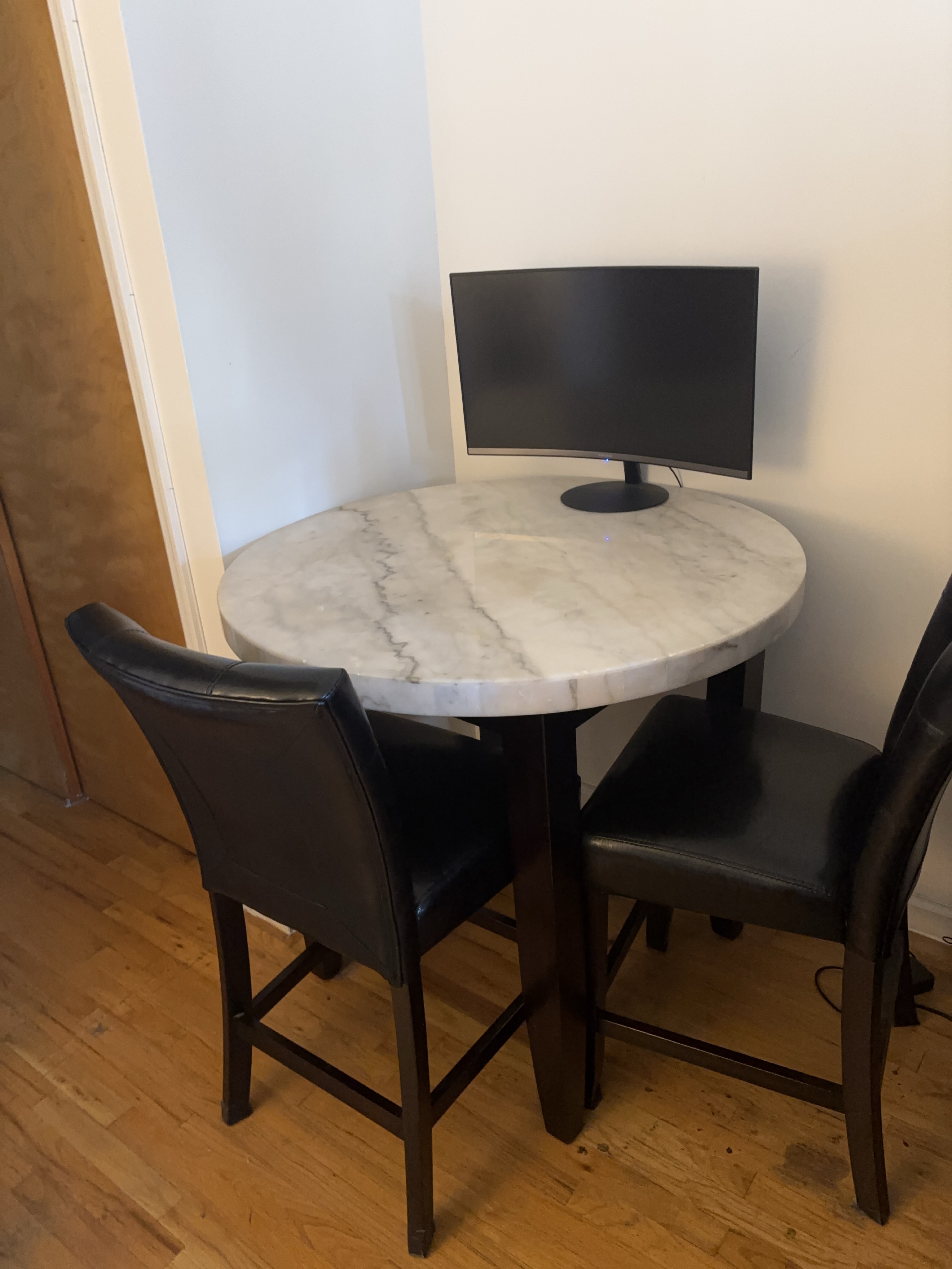 Marble Round Table with Two Black Leather Chairs