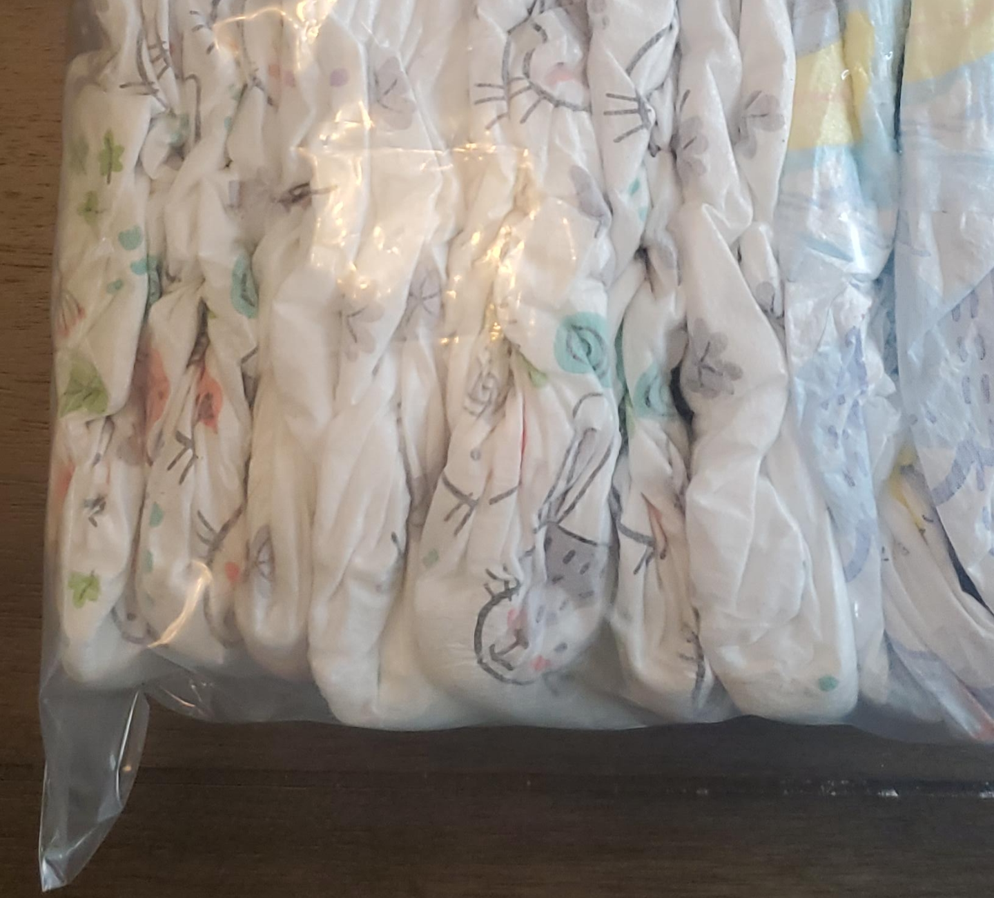 Package of Baby Diapers 7+3 kirkland size 3 +swimming thumbnail