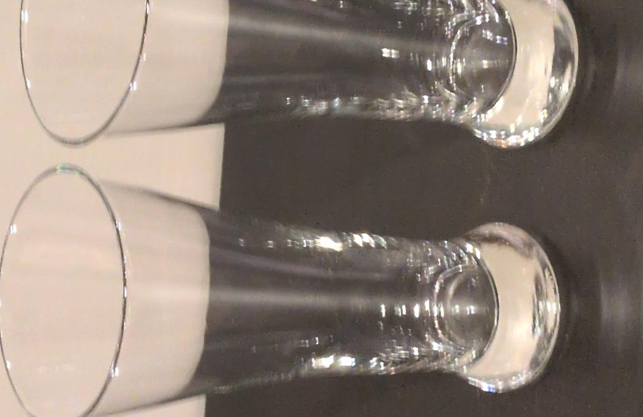 Set of 2 Clear Glass pilsner glasses.